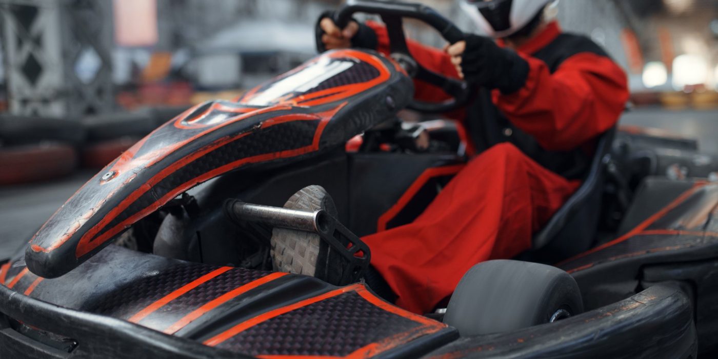 Kart racer enters the turn, karting auto sport