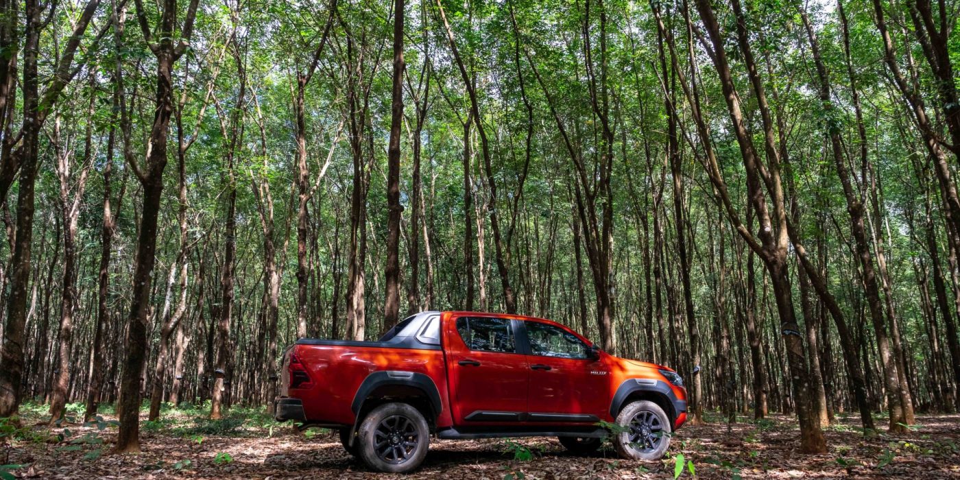 Gialai, Vietnam - Dec 12, 2020: Toyota Hilux pick-up car is on the forest roads in road-trip in Vietnam.