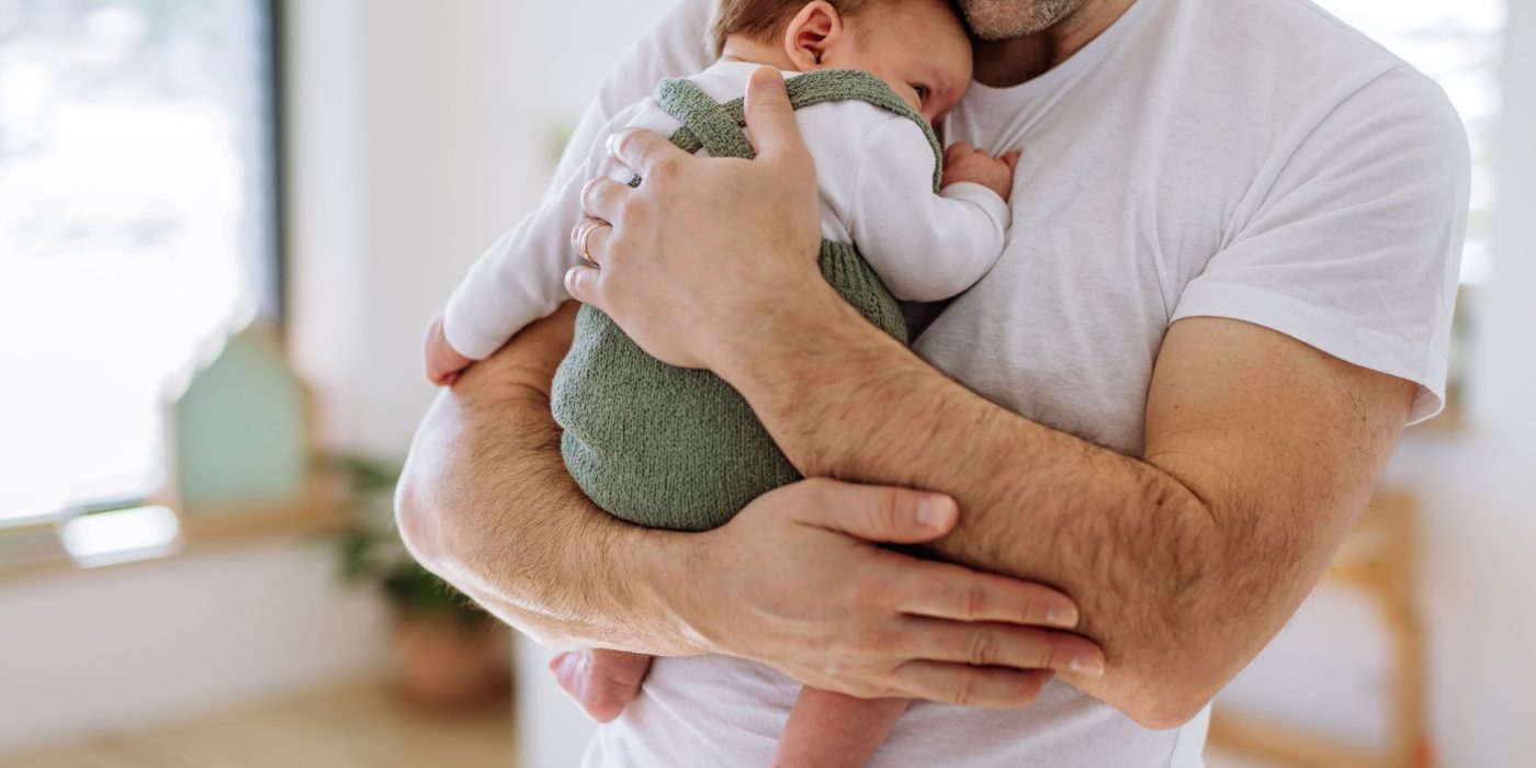 Close-up of father holding his little son.