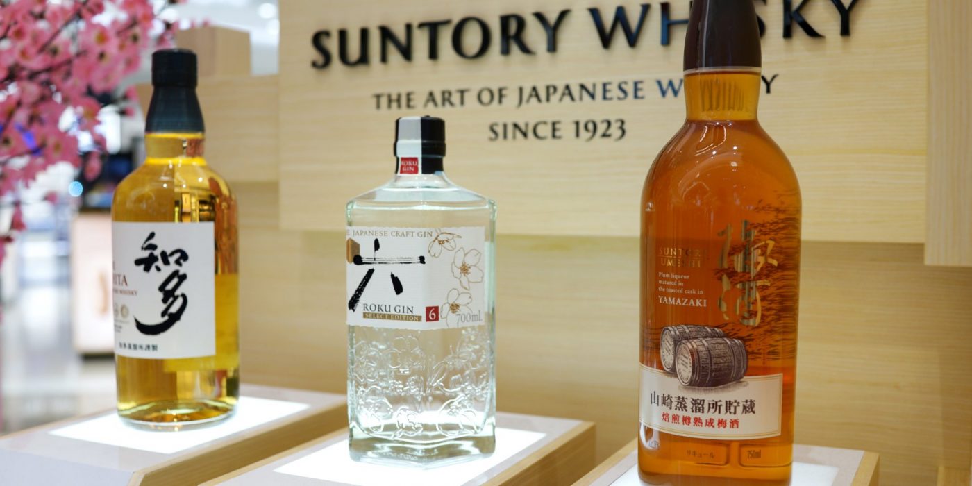 SINGAPORE - APR 22, 2018: Various choice of Suntory Whisky on store shelf in Changi Airport Terminal 4. Suntory is one of the oldest companies in the distribution of alcoholic beverages in Japan.