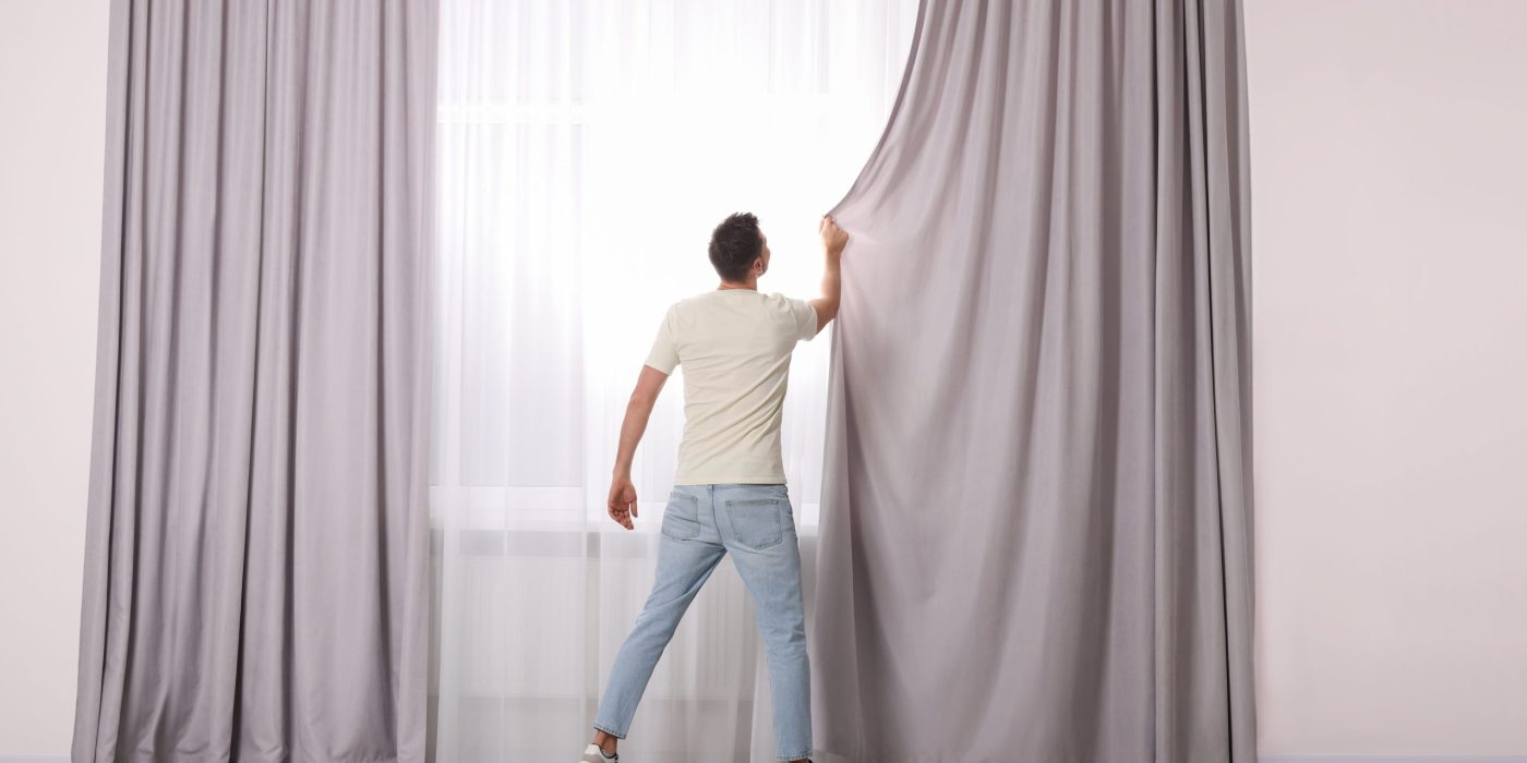 Australian home interior featuring lined curtains, energy-efficient thermal curtains, and premium Australian made curtains covering large windows.